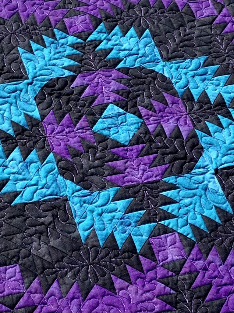 Purple Pineapple quilt made for a two-color quilt guild challenge.