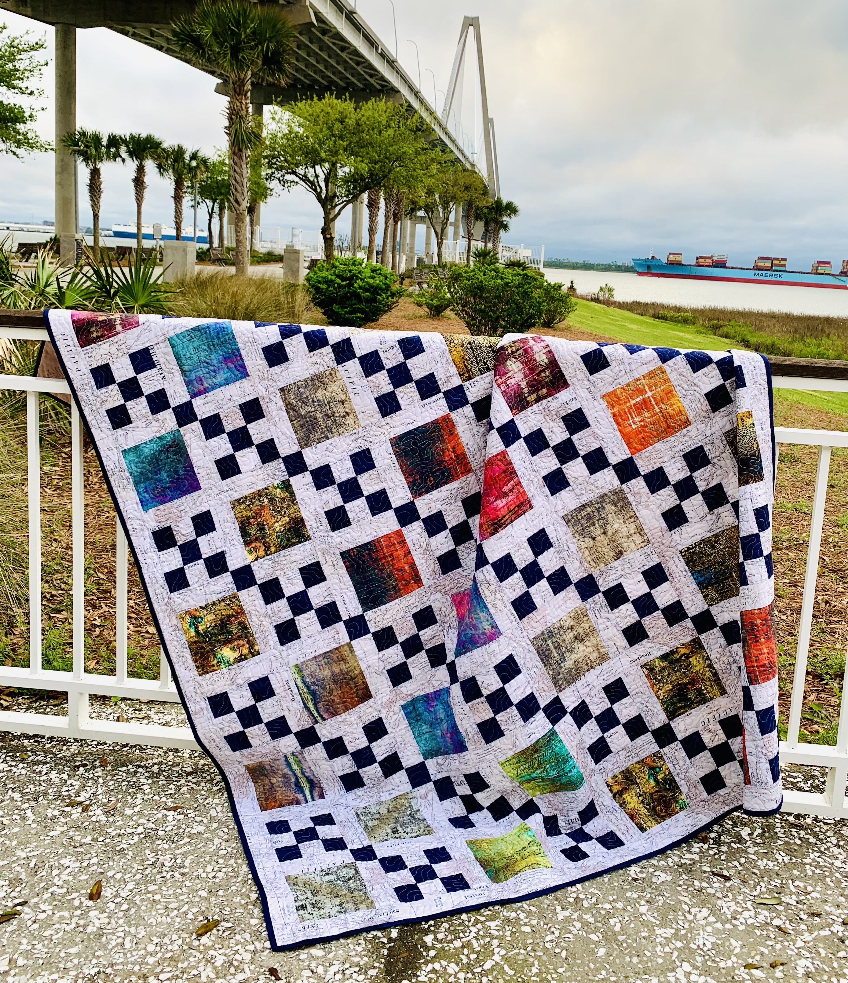 Weekender quilt pattern draped on a fence at Waterfront Park in Mt. Pleasant, SC.